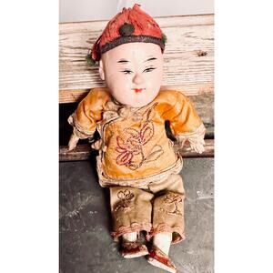 Antique Asian boy doll.